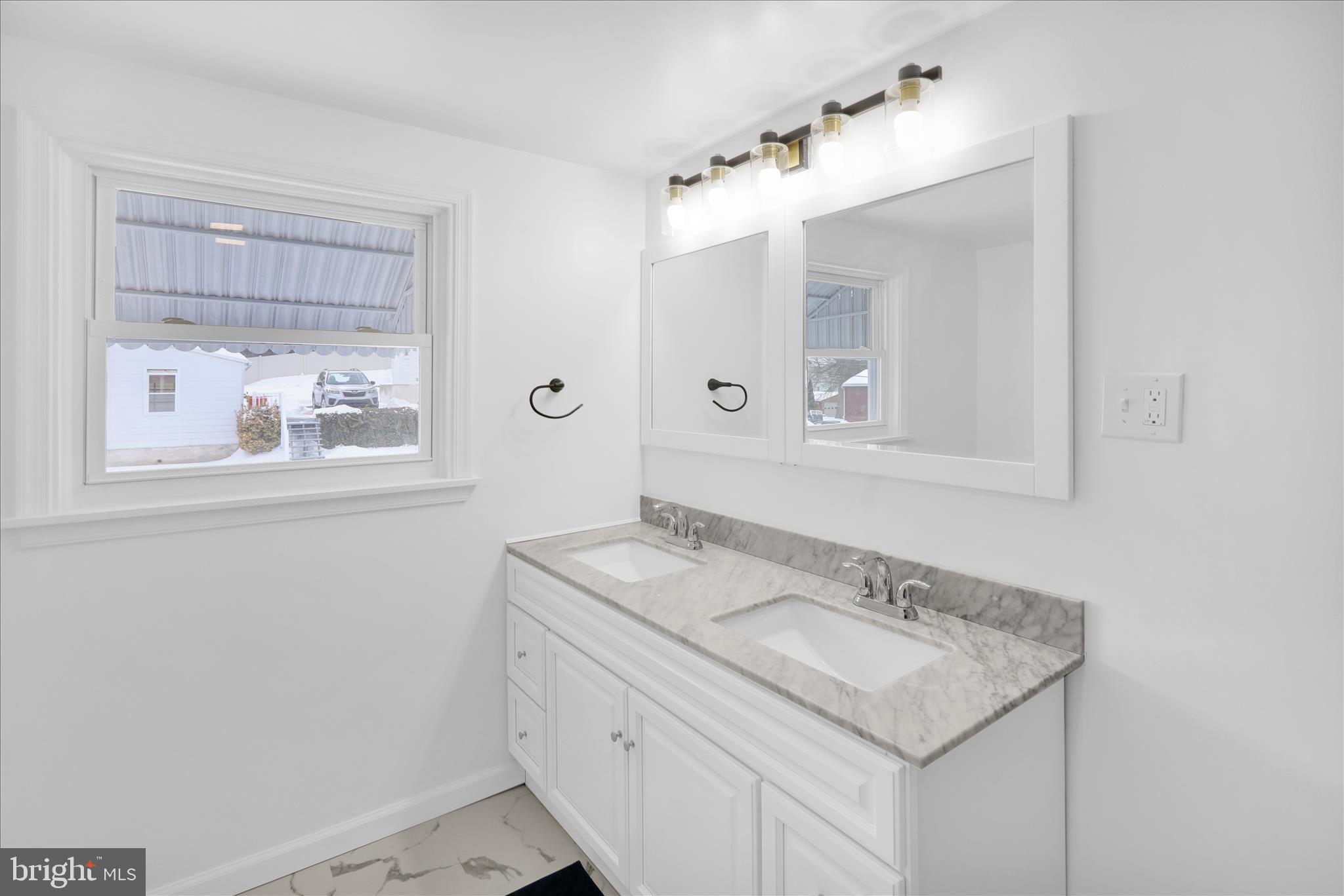 42 Chestnut Street Mohnton, PA 19540 - Photo 26 of 30 a bathroom with a granite countertop sink and a mirror