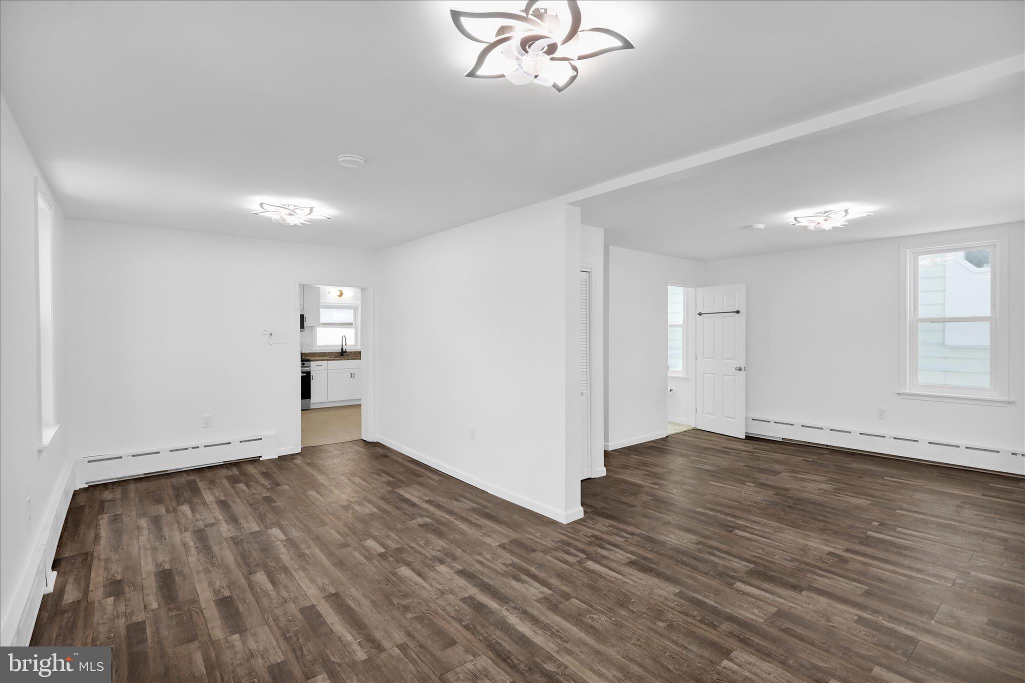 42 Chestnut Street Mohnton, PA 19540 - Photo 5 of 30 a view of an empty room with wooden floor and a window