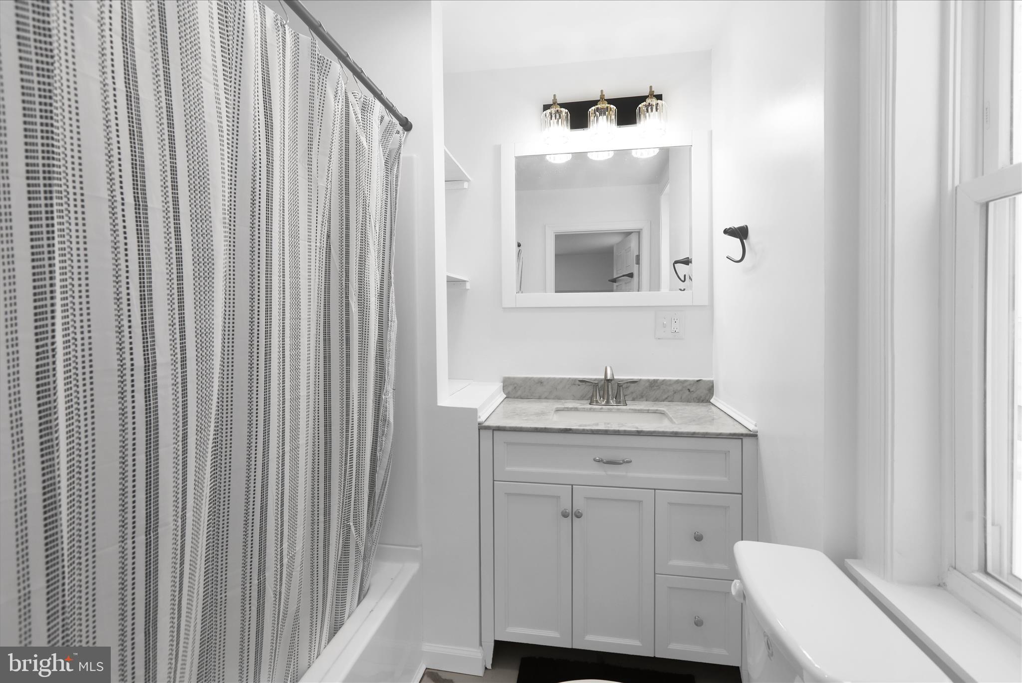 42 Chestnut Street Mohnton, PA 19540 - Photo 9 of 30 a bathroom with a granite countertop sink and a mirror