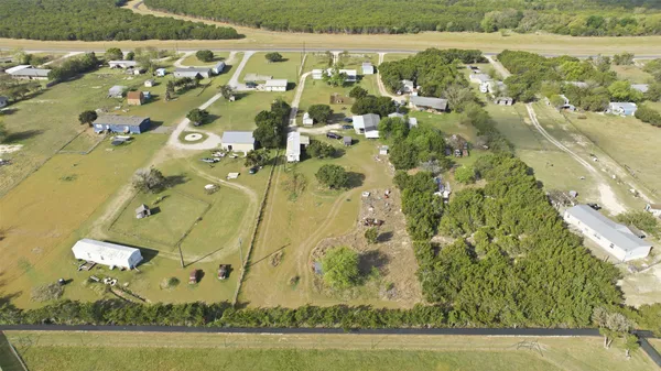 an aerial view of residential houses with outdoor space