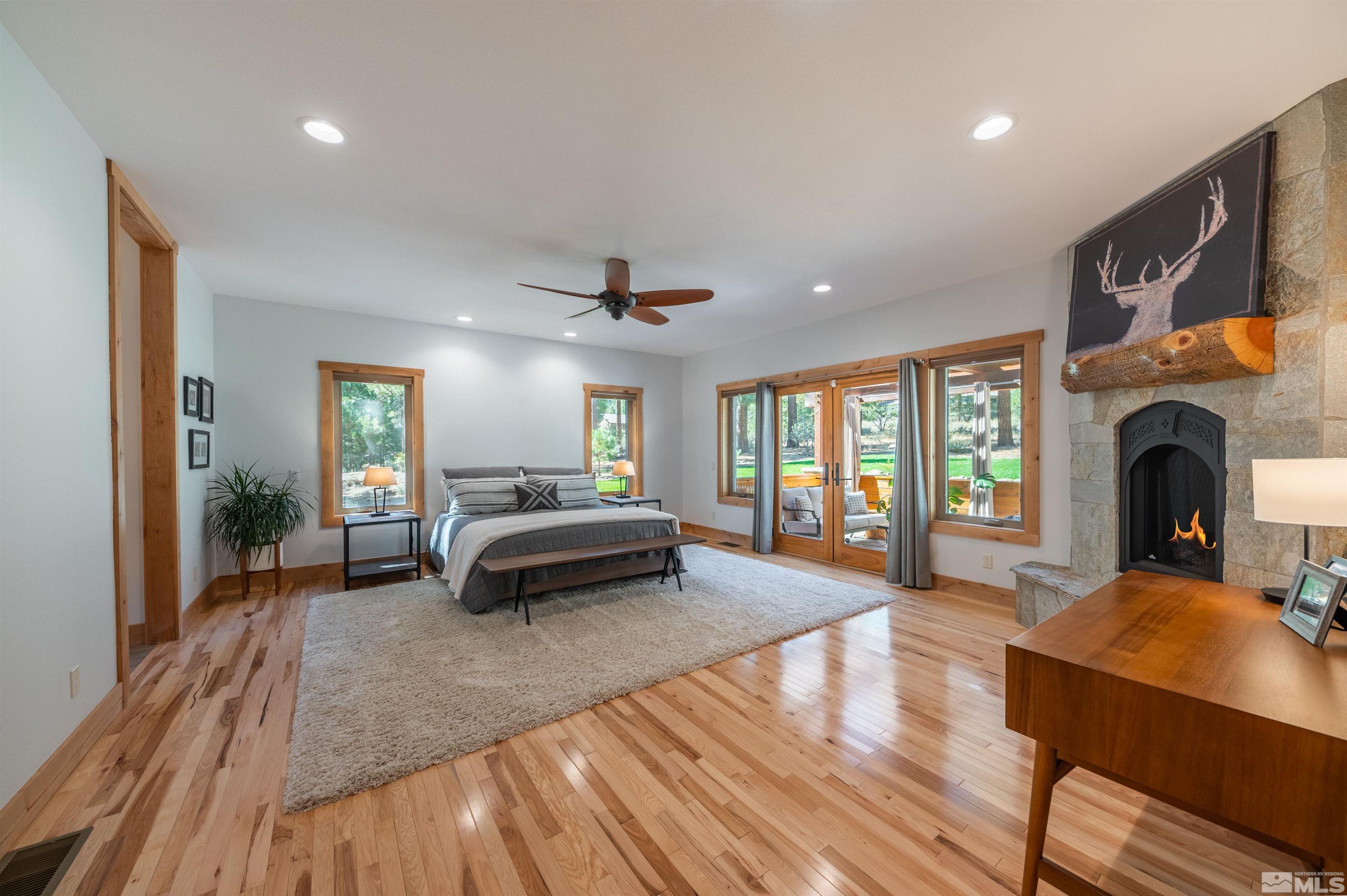 500 Yellow Pine Road Reno, NV 89511 - Photo 19 of 40 a bedroom with furniture and a fireplace