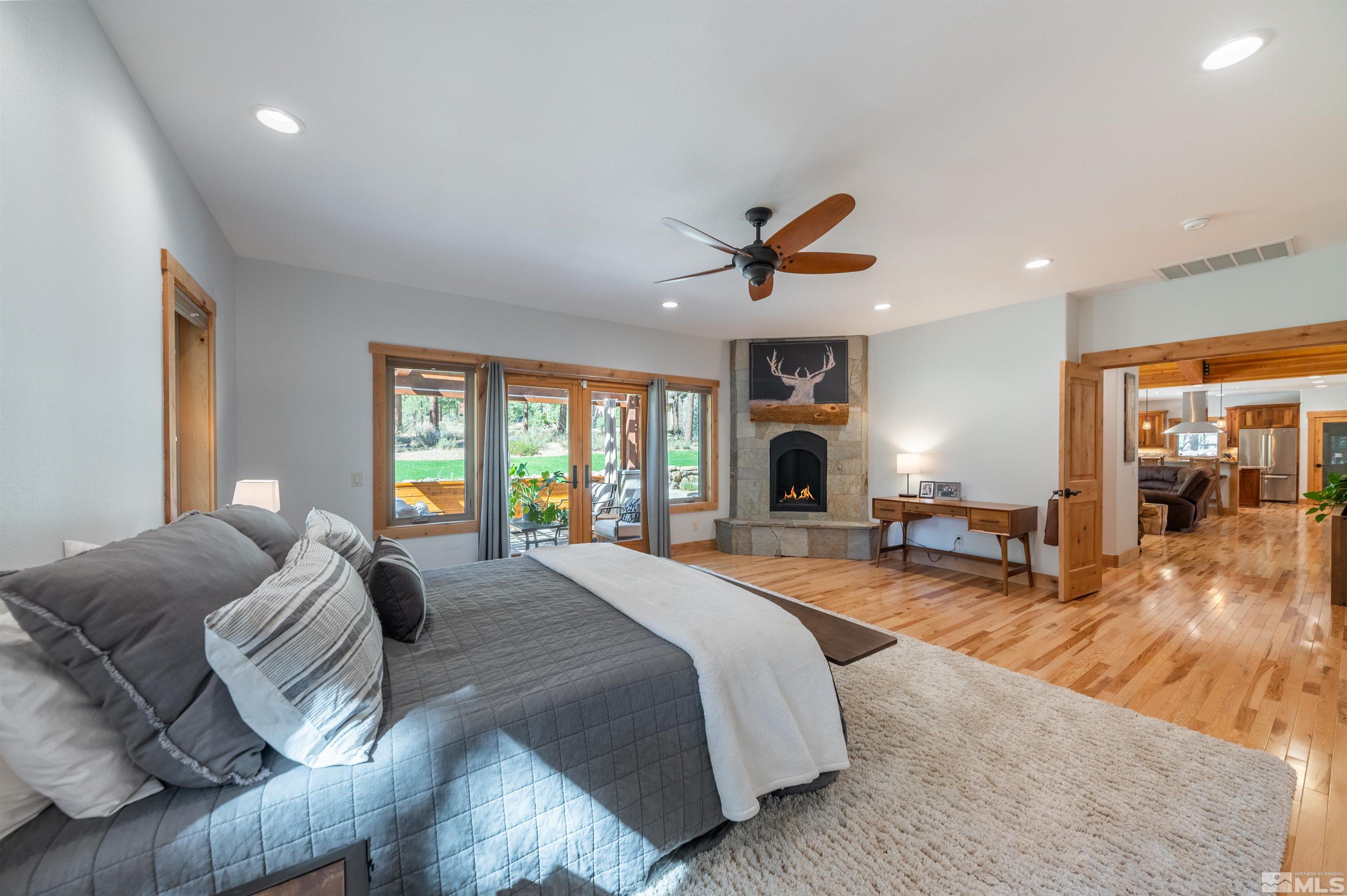 500 Yellow Pine Road Reno, NV 89511 - Photo 21 of 40 a spacious bedroom with a bed a couch and dresser