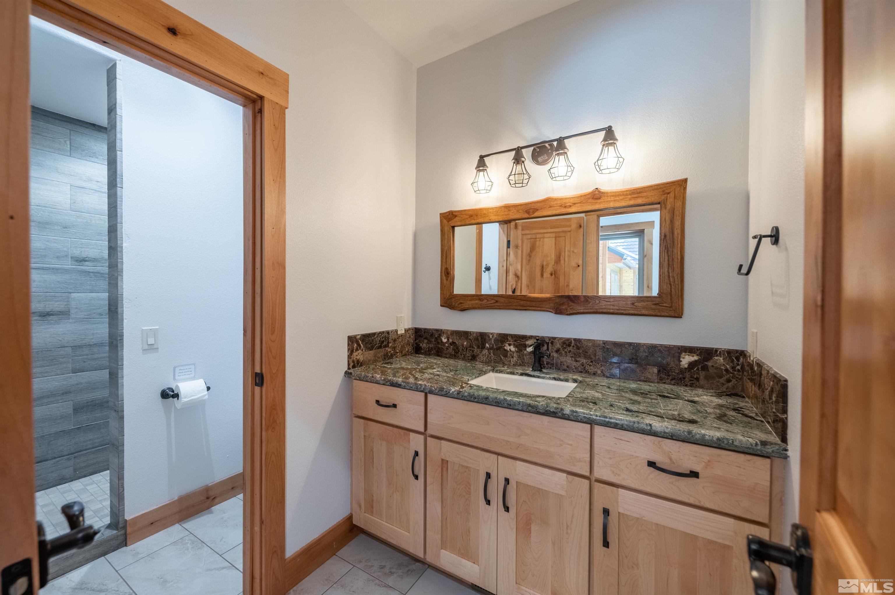 500 Yellow Pine Road Reno, NV 89511 - Photo 29 of 40 a bathroom with a sink and a mirror