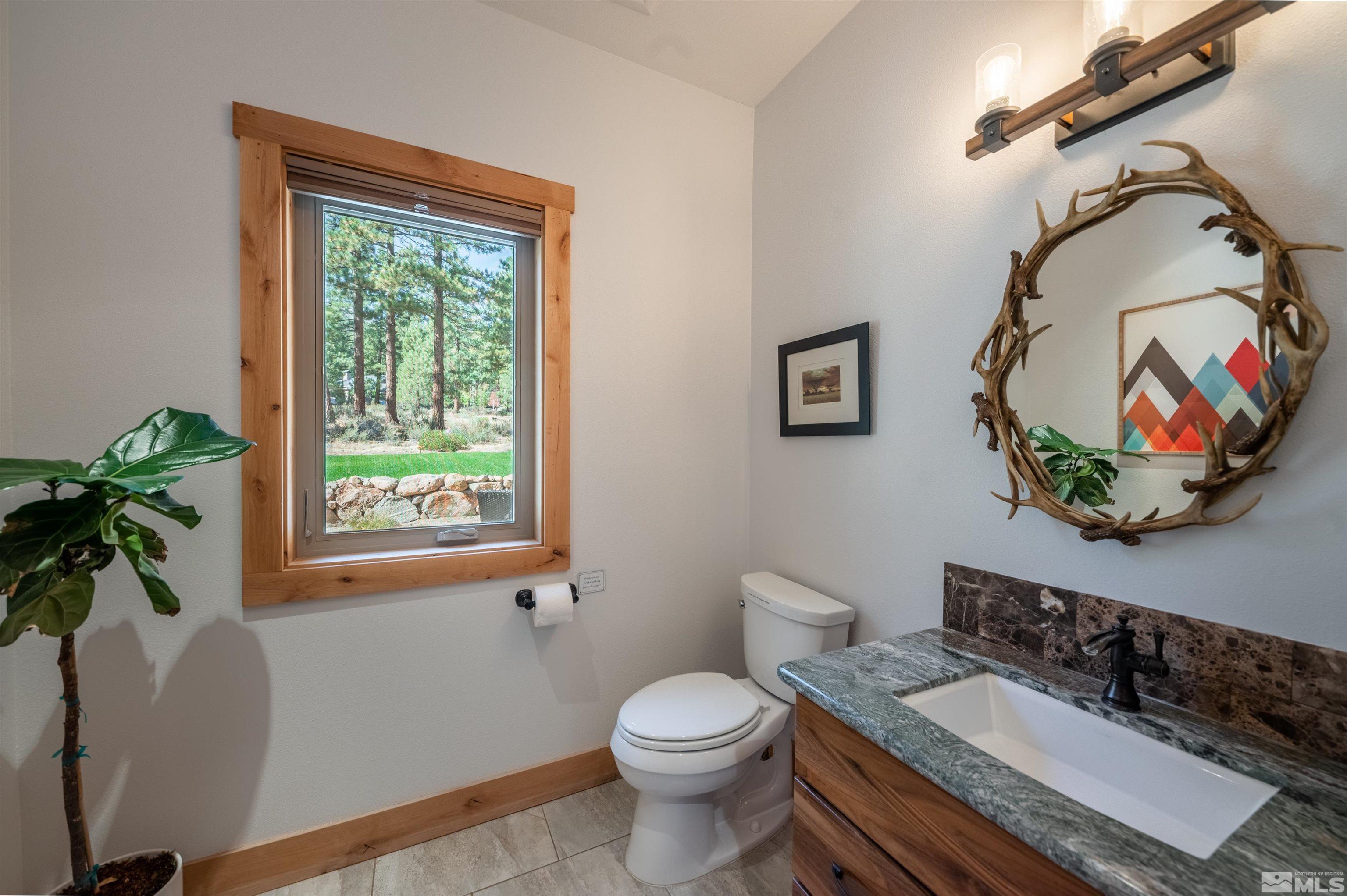 500 Yellow Pine Road Reno, NV 89511 - Photo 31 of 40 a bathroom with a toilet sink and mirror