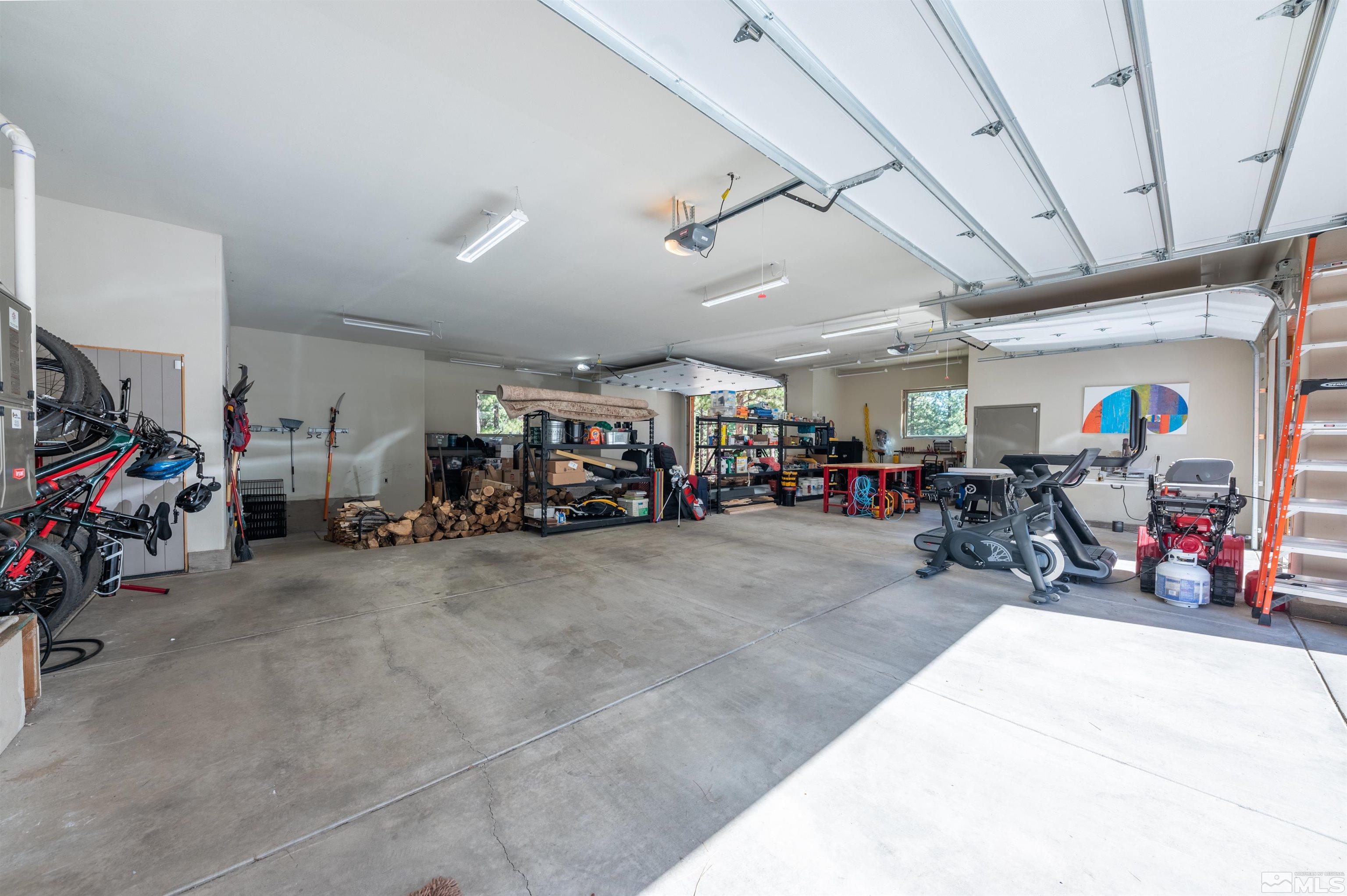 500 Yellow Pine Road Reno, NV 89511 - Photo 32 of 40 a view of a garage with a bike and car