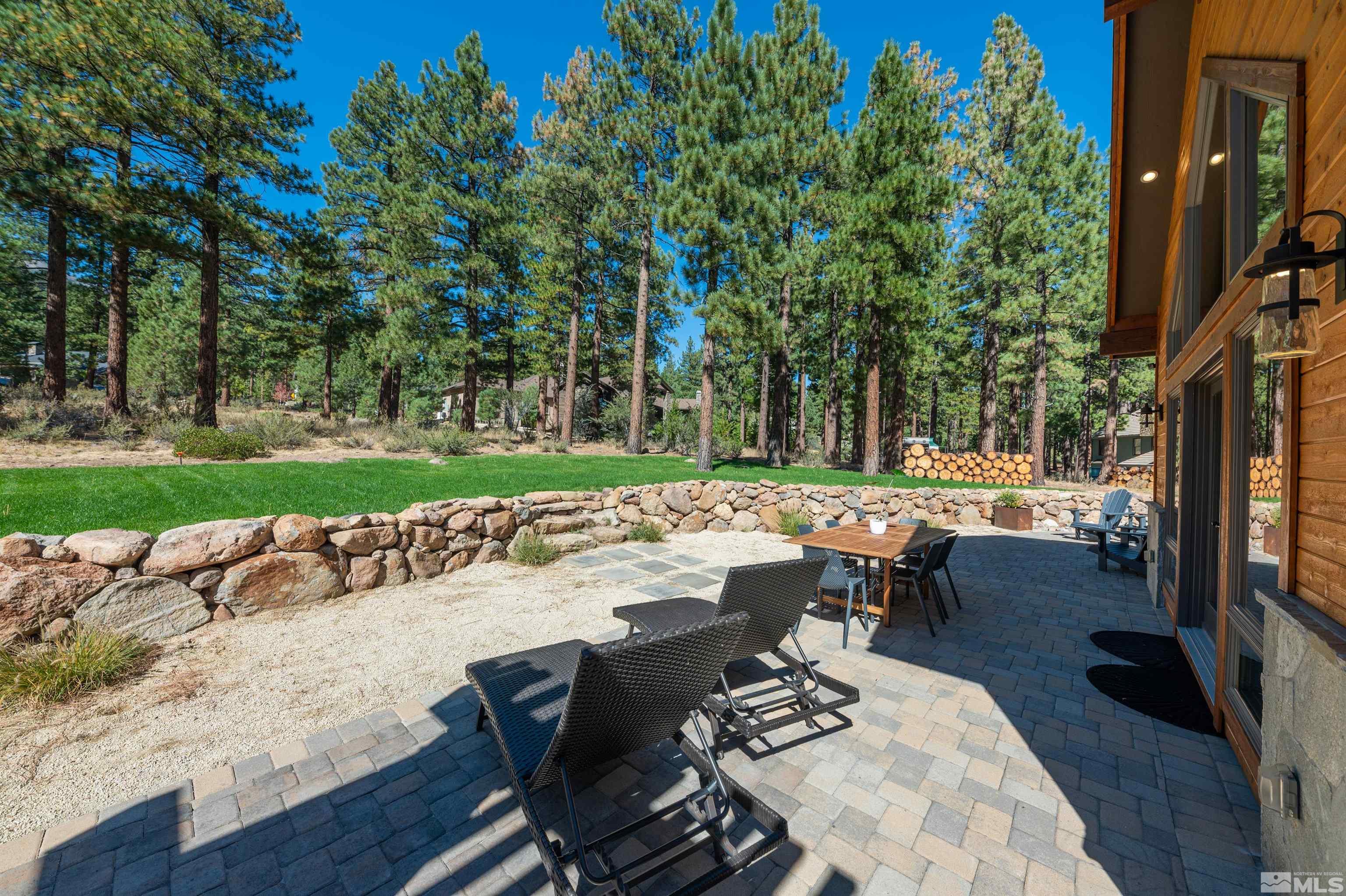 500 Yellow Pine Road Reno, NV 89511 - Photo 35 of 40 a view of a patio with table and chairs and garden