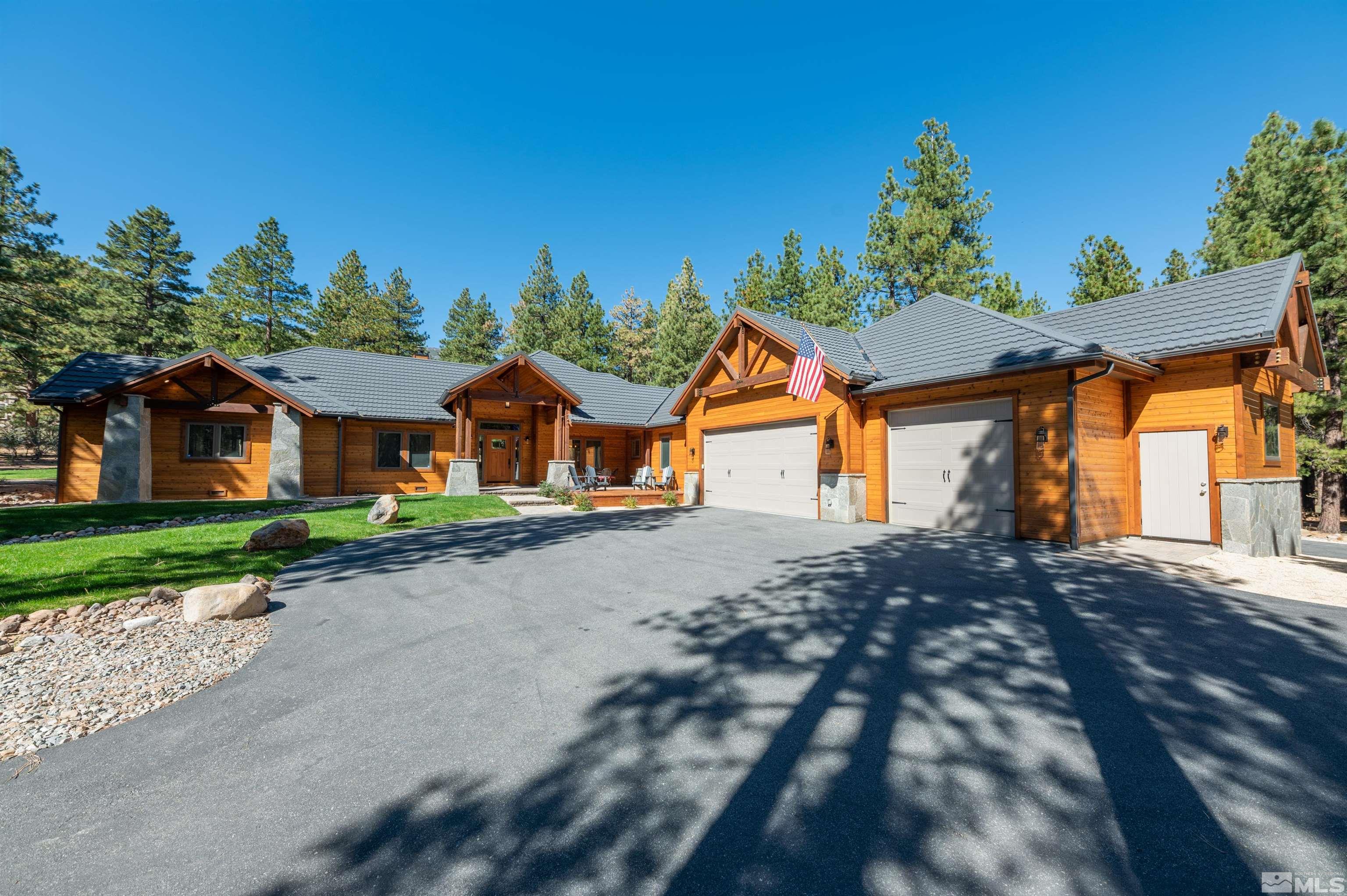 500 Yellow Pine Road Reno, NV 89511 - Photo 4 of 40 a front view of a house with a yard and garage