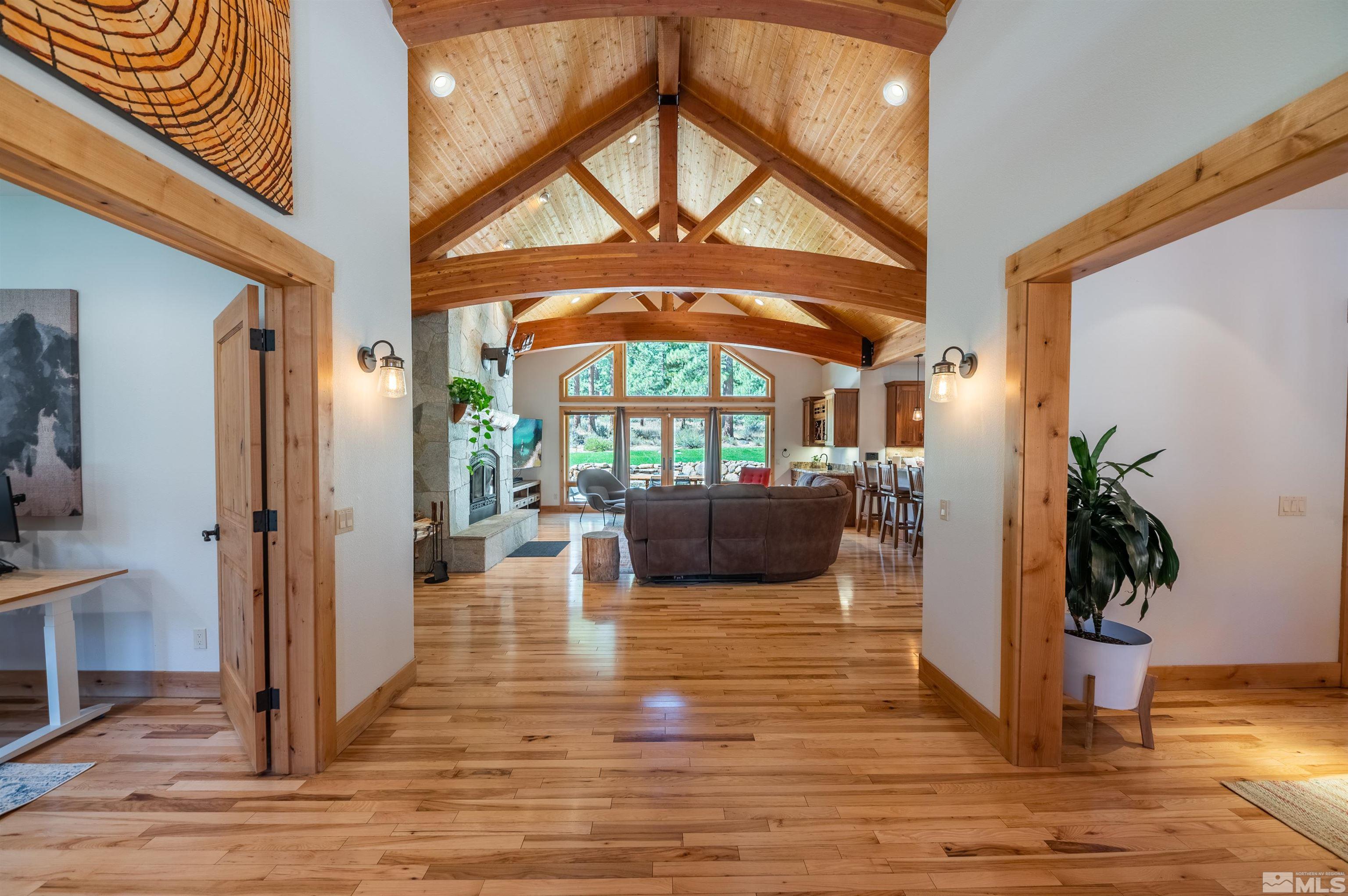 500 Yellow Pine Road Reno, NV 89511 - Photo 7 of 40 a living room with furniture floor to ceiling window and wooden floor
