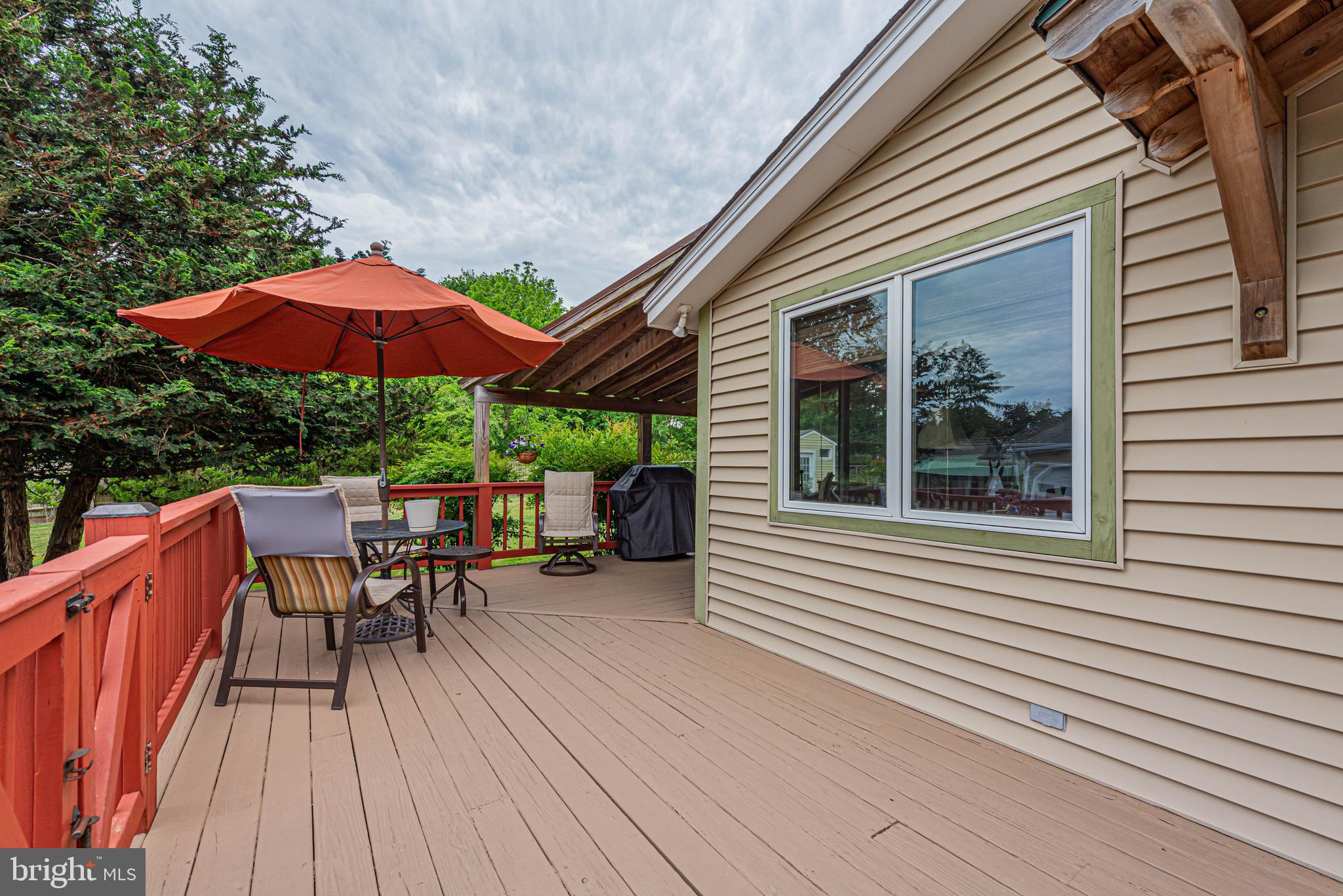 31468 Wingate Road Dagsboro, DE 19939 - Photo 43 of 48 a view of house with wooden deck and outdoor seating