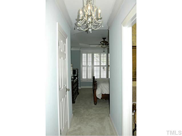 2305 St Paul's Square Raleigh, NC 27614 - Photo 12 of 25 Enter into the downstairs master bedroom through this hallway and elegant chandelier. Other