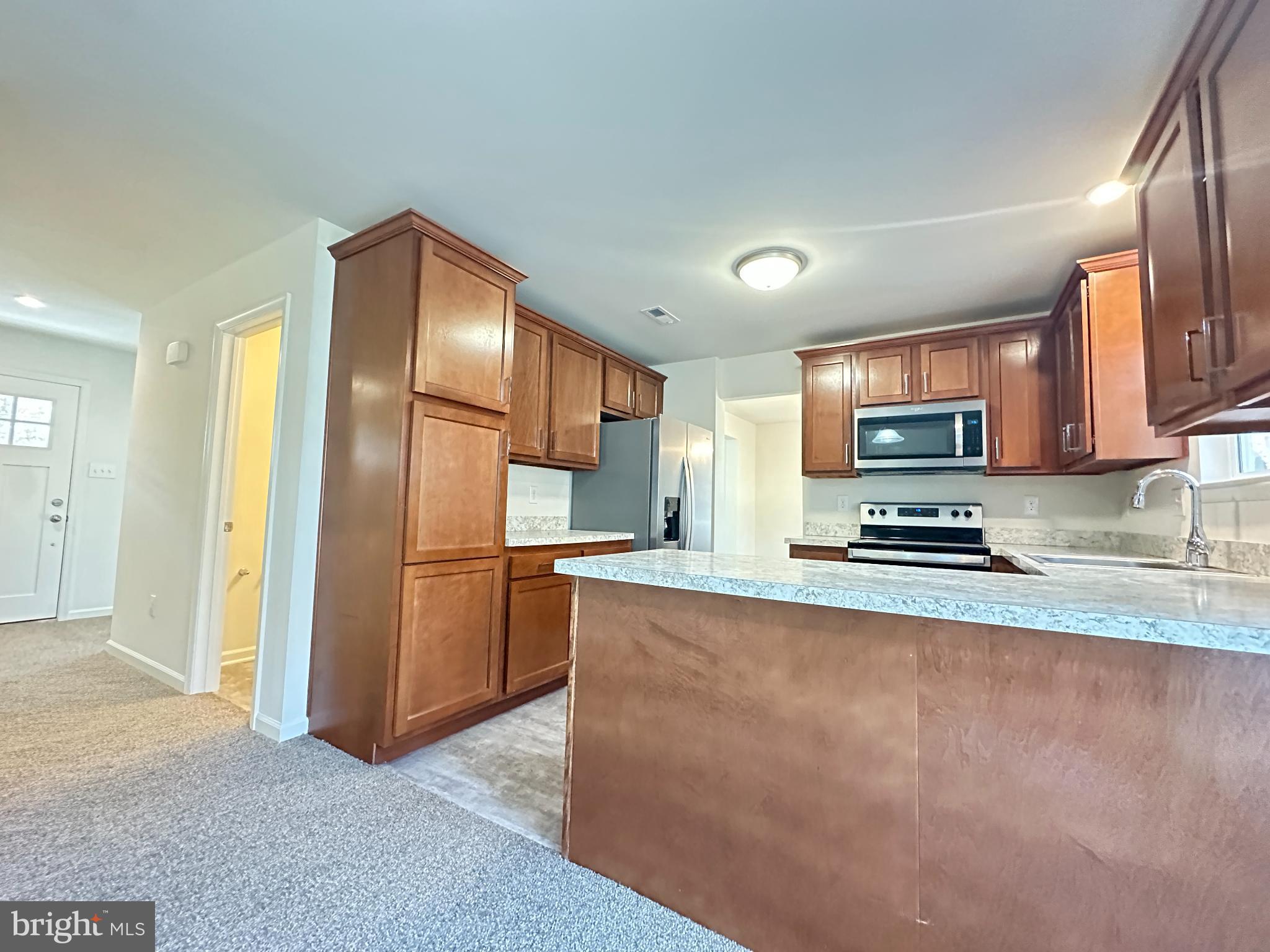377 Minck Avenue West Berlin, NJ 08091 - Photo 2 of 24 a kitchen with stainless steel appliances granite countertop a refrigerator a stove top oven a sink and dishwasher