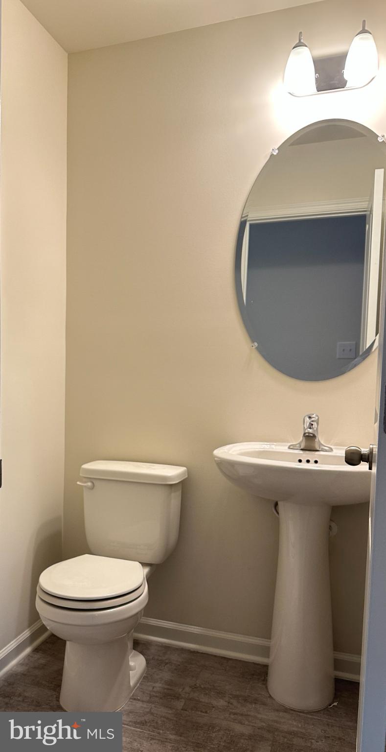377 Minck Avenue West Berlin, NJ 08091 - Photo 9 of 24 a bathroom with a toilet a sink and mirror