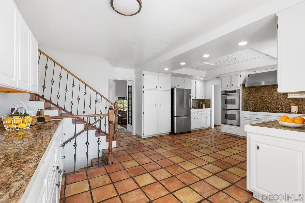13747 Little Pond Road Valley Center, CA 92082 - Photo 11 of 39 a view of kitchen with furniture and a refrigerator