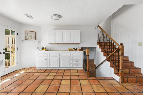 a kitchen with a cabinets and window