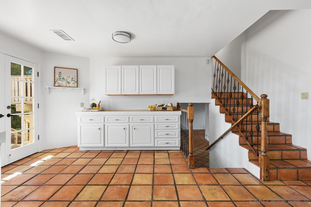 13747 Little Pond Road Valley Center, CA 92082 - Photo 13 of 39 a kitchen with a cabinets and window