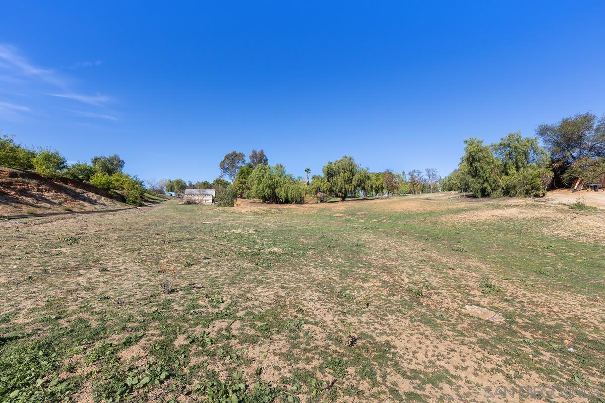 13747 Little Pond Road Valley Center, CA 92082 - Photo 30 of 39 a view of a field with trees in background