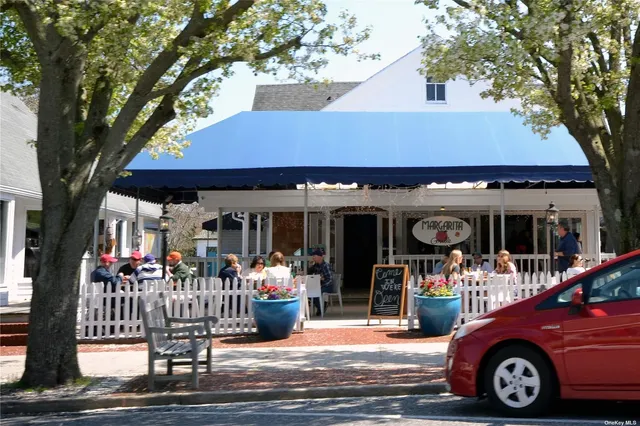 a front view of a house with a porch