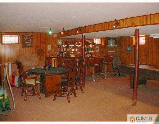 114 South Cliff Road Colonia, NJ 07067 - Photo 4 of 10 a dining room with furniture and a table