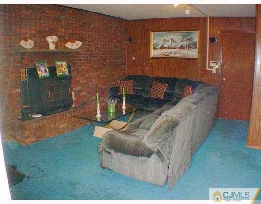 114 South Cliff Road Colonia, NJ 07067 - Photo 6 of 10 a living room with furniture and a rug