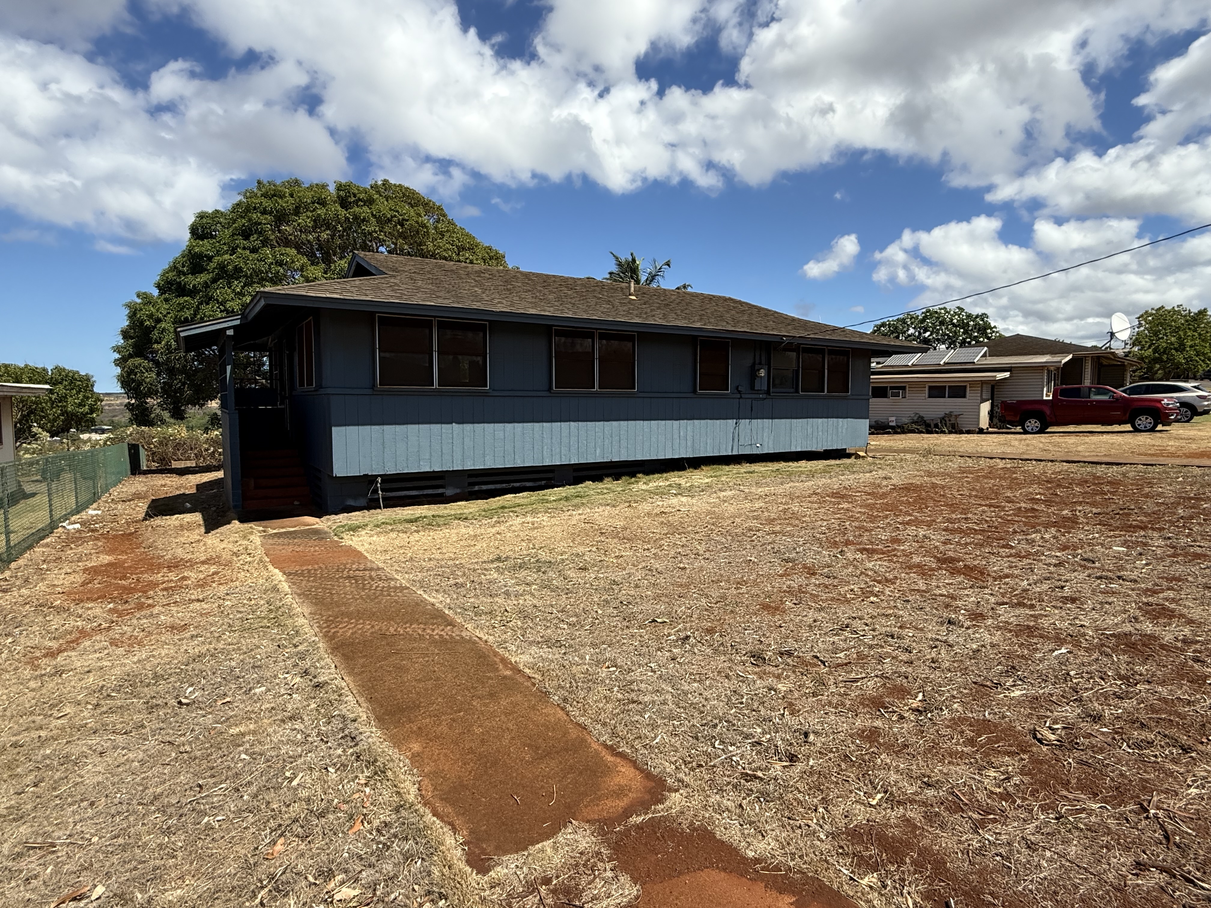 4661 Melemele Road Eleele, HI 96705 - Photo 3 of 15 a front view of a house with a yard