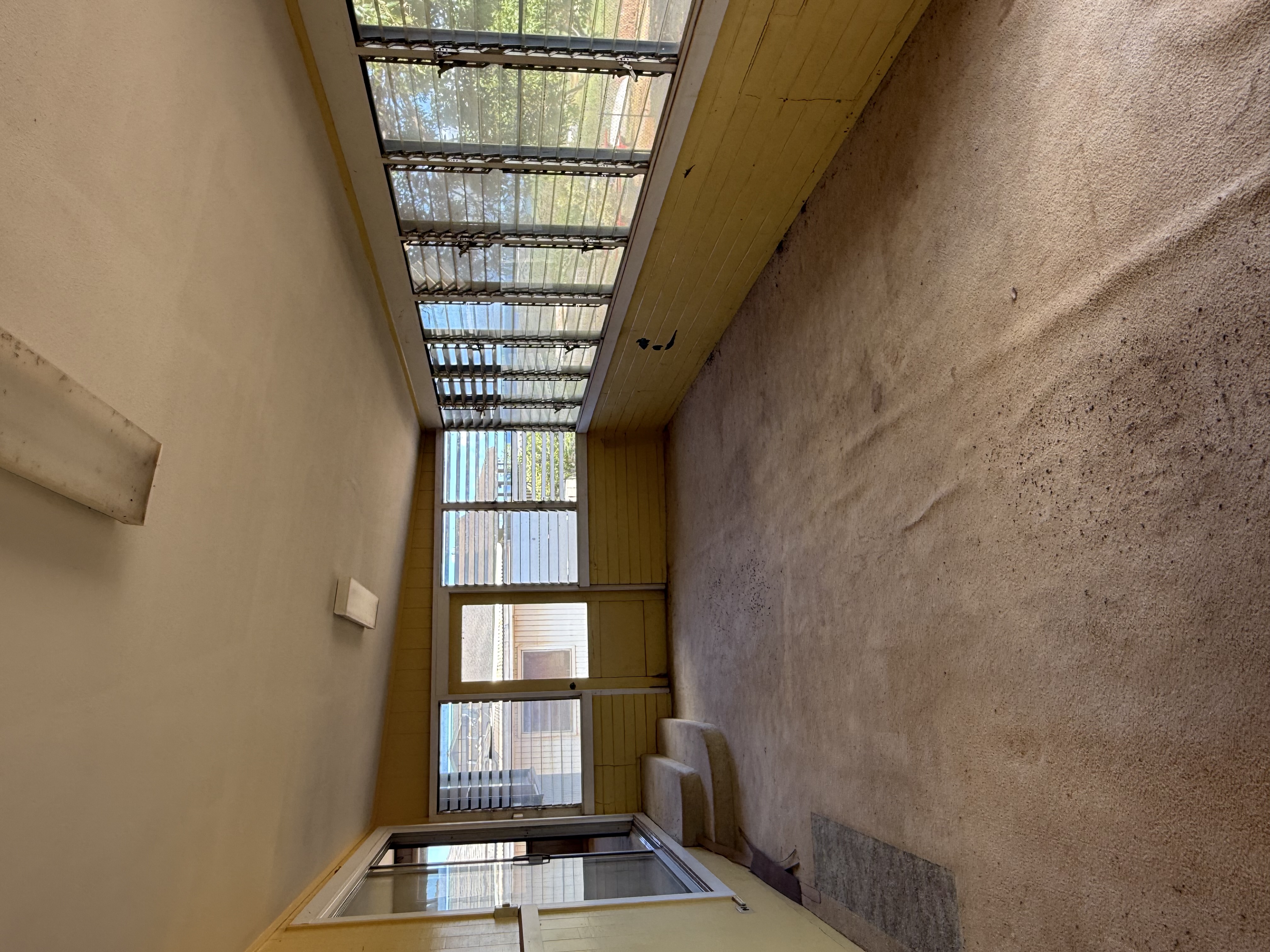 4661 Melemele Road Eleele, HI 96705 - Photo 5 of 15 a living room with furniture and a floor to ceiling window
