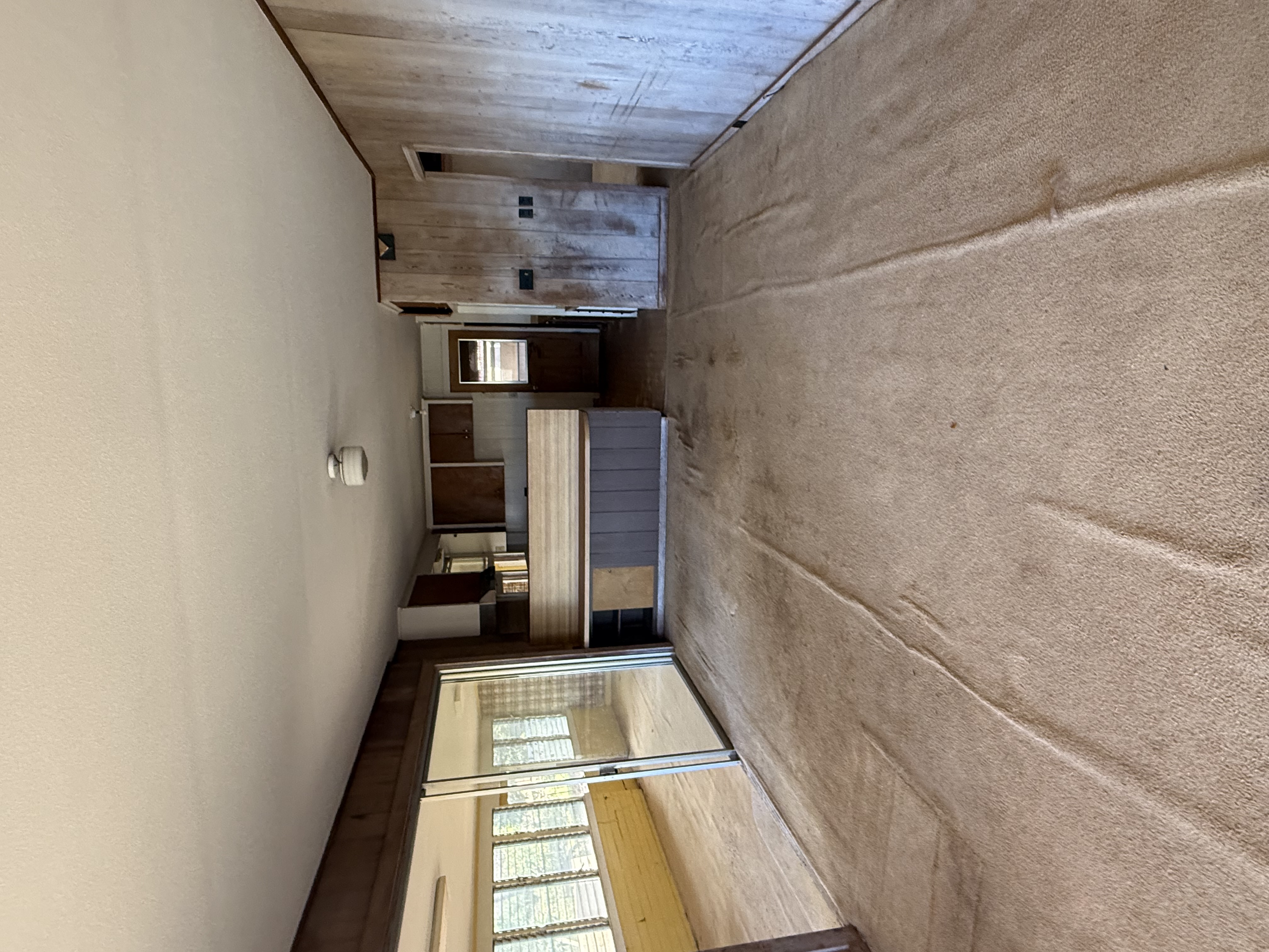 4661 Melemele Road Eleele, HI 96705 - Photo 7 of 15 a view of an empty room with a fireplace and windows