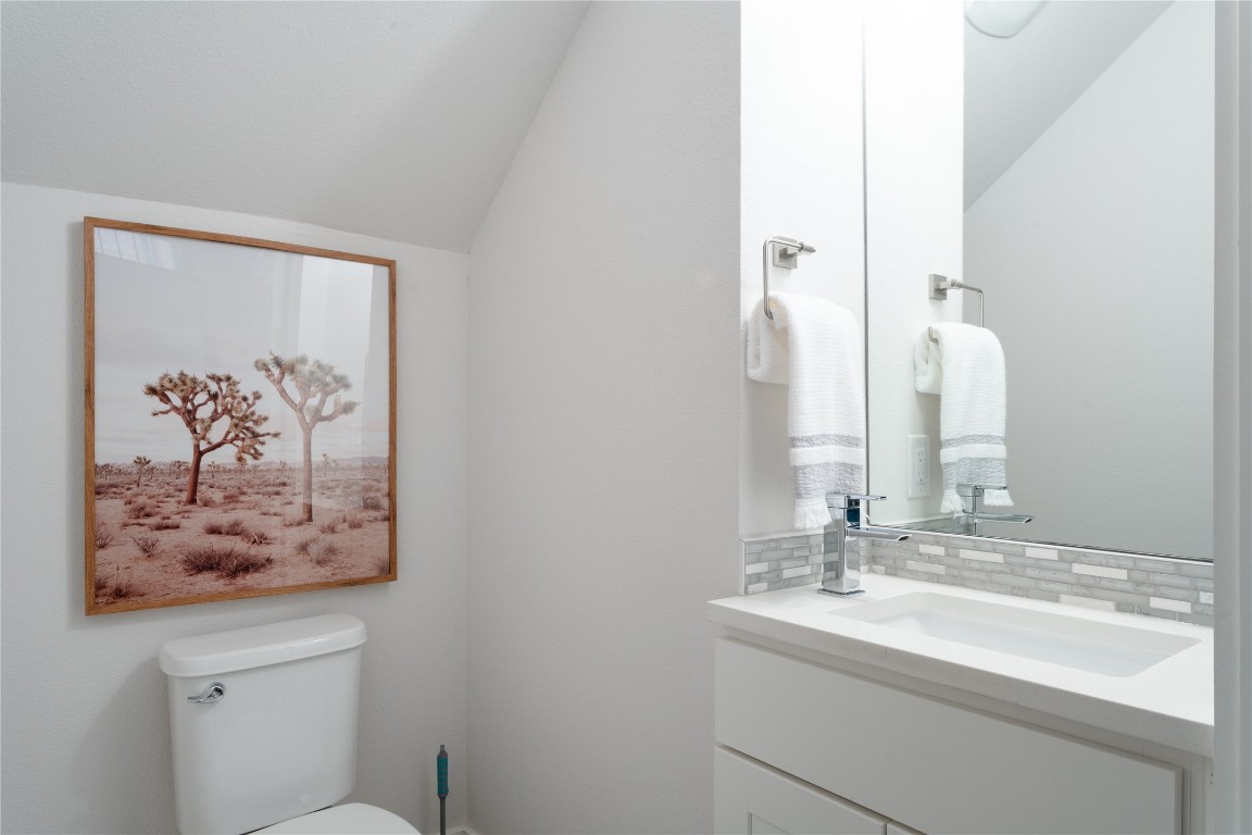 2906 Webberville Road, Unit 2 Austin, TX 78702 - Photo 20 of 21 a bathroom with a sink and a mirror