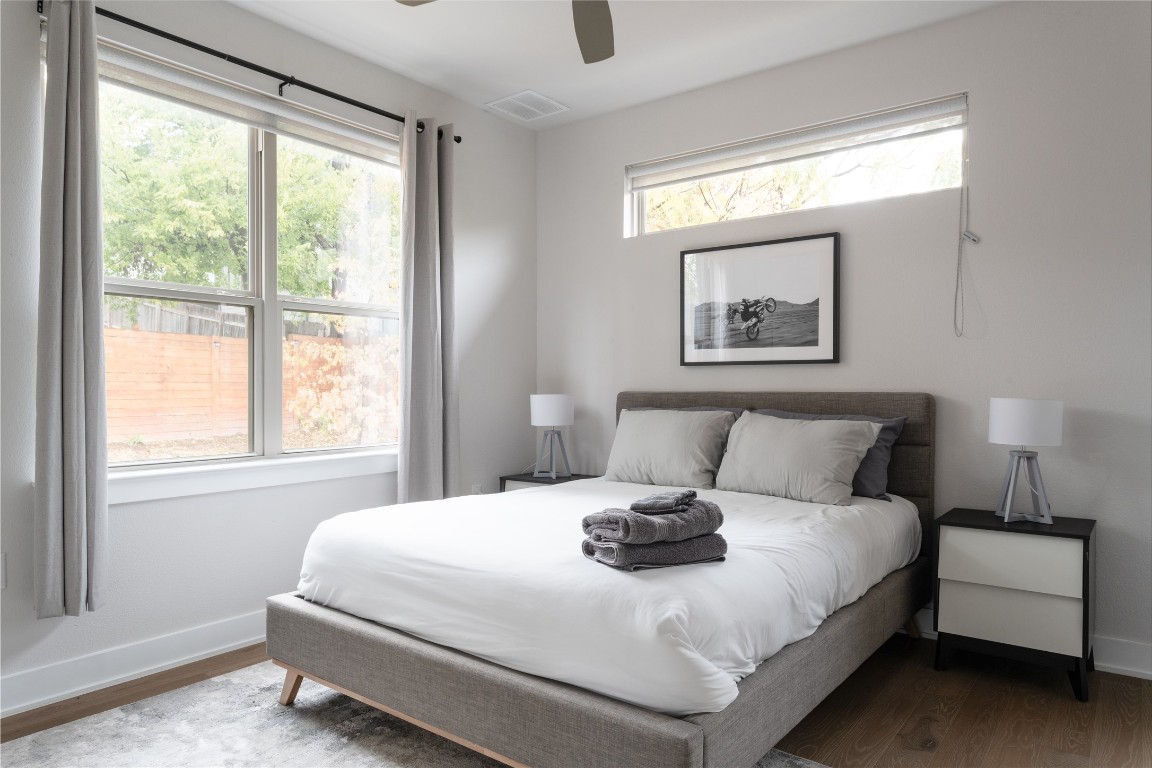 2906 Webberville Road, Unit 2 Austin, TX 78702 - Photo 7 of 21 a bedroom with a large bed and a window