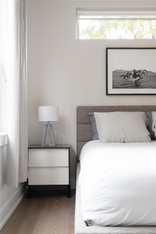 2906 Webberville Road, Unit 2 Austin, TX 78702 - Photo 9 of 21 a bedroom with a bed and lamp with window