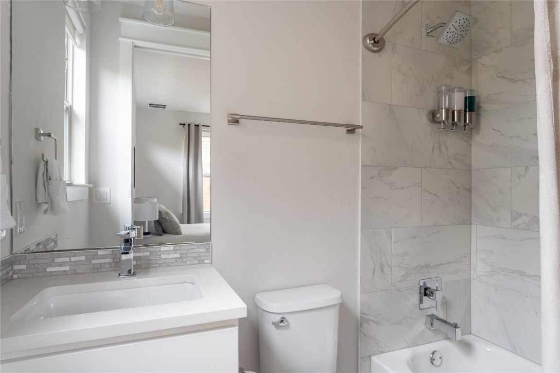 2906 Webberville Road, Unit 2 Austin, TX 78702 - Photo 10 of 21 a bathroom with a sink toilet and shower