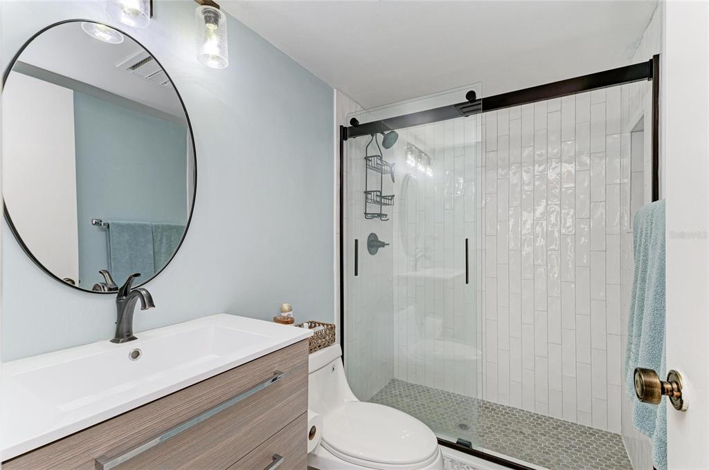 756 White Pine Tree Road, Unit 210 Venice, FL 34285 - Photo 19 of 55 a bathroom with a sink toilet and shower