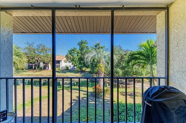a view of a balcony with wooden floor