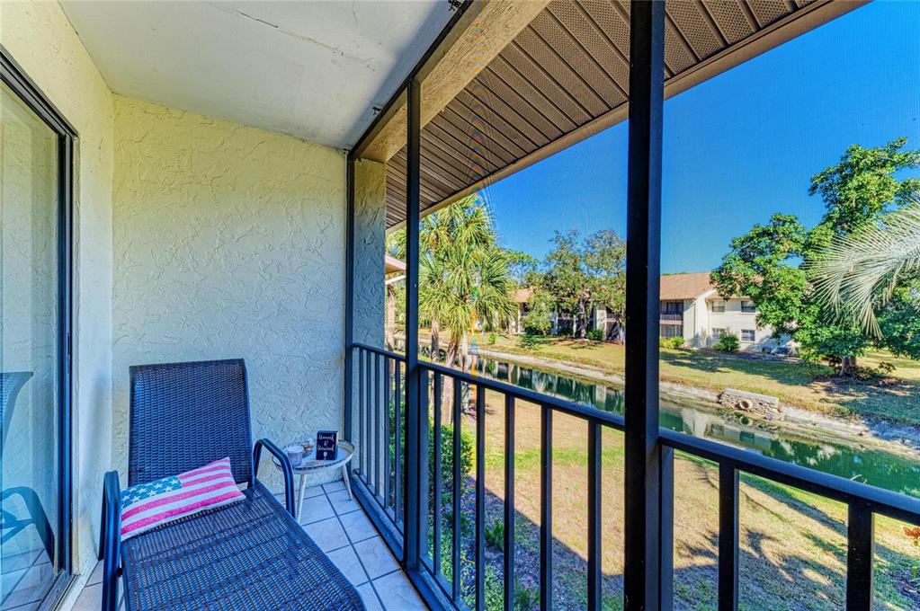 756 White Pine Tree Road, Unit 210 Venice, FL 34285 - Photo 21 of 55 a view of a balcony with wooden floor
