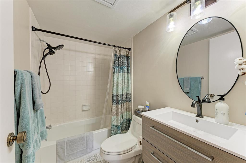 756 White Pine Tree Road, Unit 210 Venice, FL 34285 - Photo 26 of 55 a bathroom with a sink a toilet and a mirror