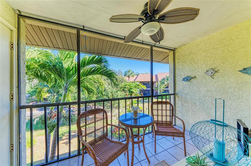 756 White Pine Tree Road, Unit 210 Venice, FL 34285 - Photo 27 of 55 a view of a balcony with furniture