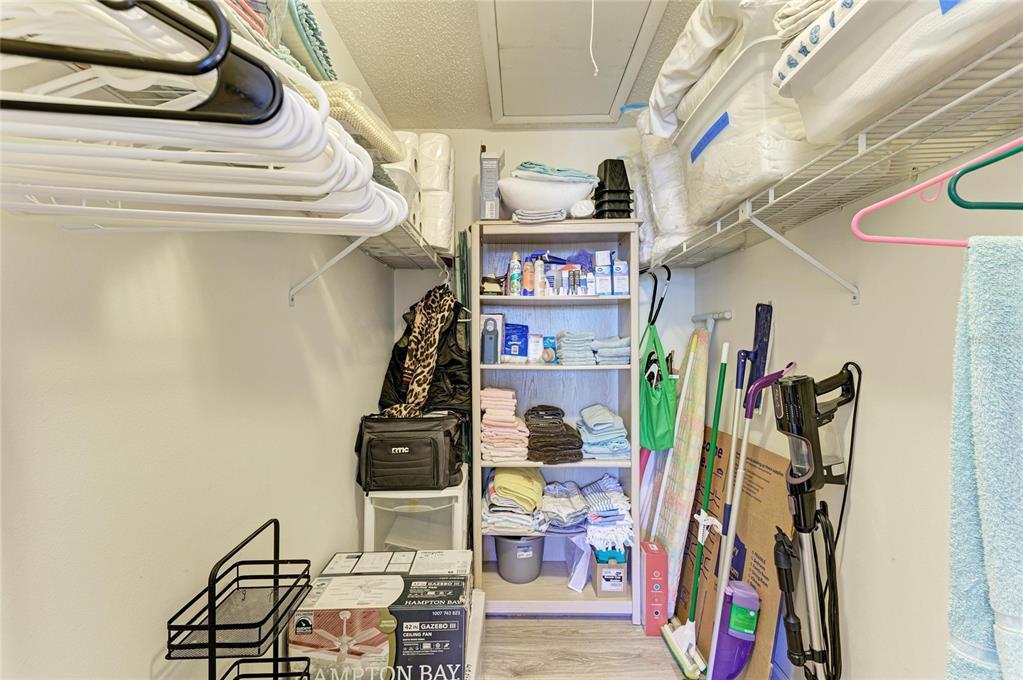 756 White Pine Tree Road, Unit 210 Venice, FL 34285 - Photo 30 of 55 a view of walk in closet with clothes and shoes