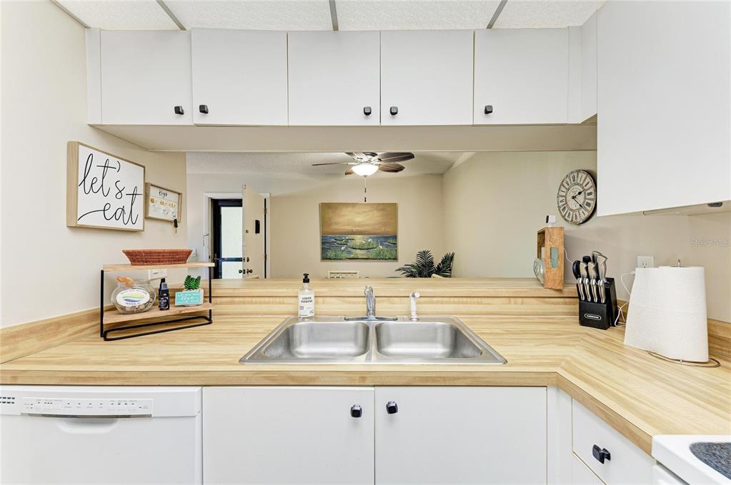 756 White Pine Tree Road, Unit 210 Venice, FL 34285 - Photo 7 of 55 a kitchen with sink and cabinets