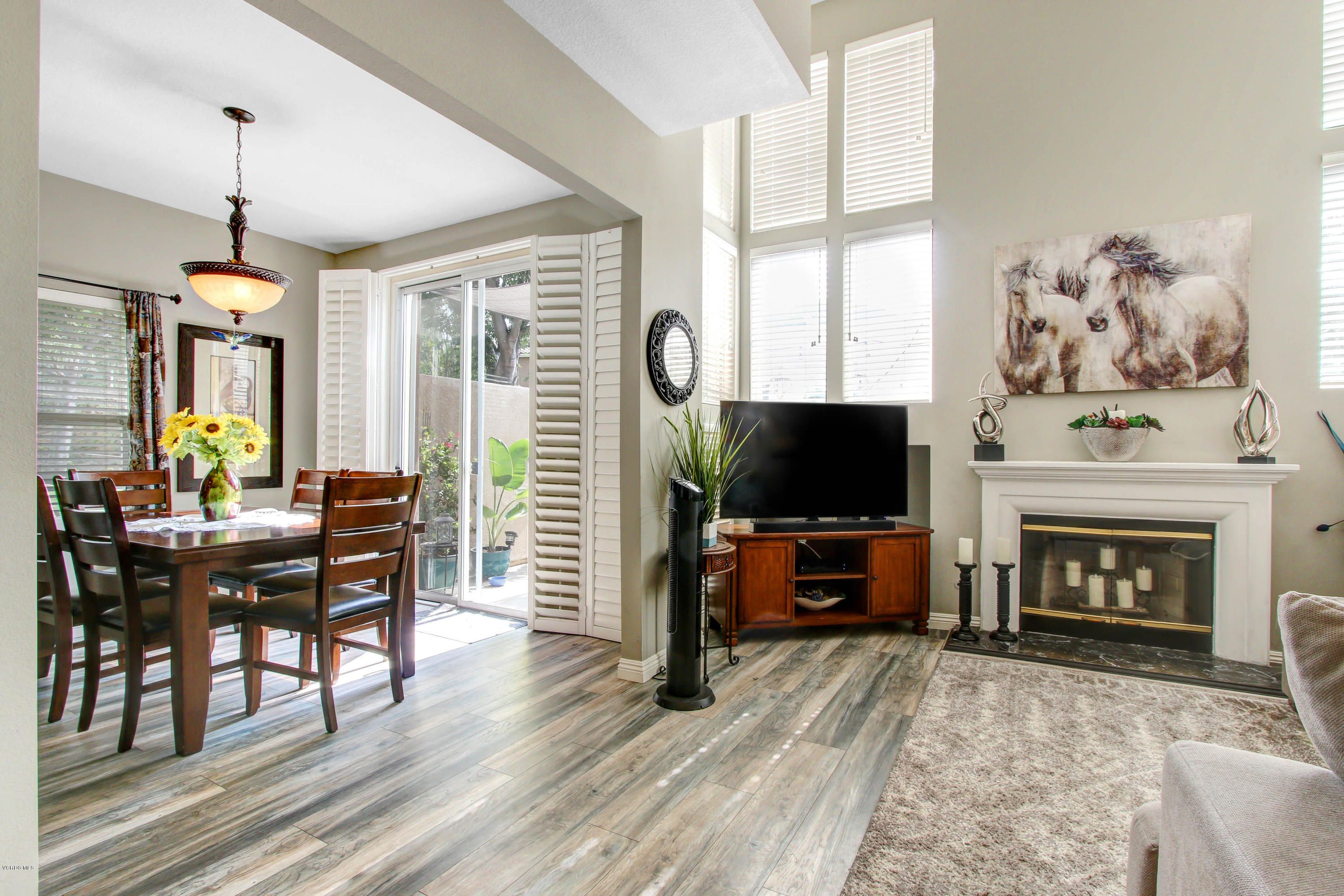 697 Lariate Lane, Unit A Simi Valley, CA 93065 - Photo 11 of 26 a living room with furniture a flat screen tv and a fireplace