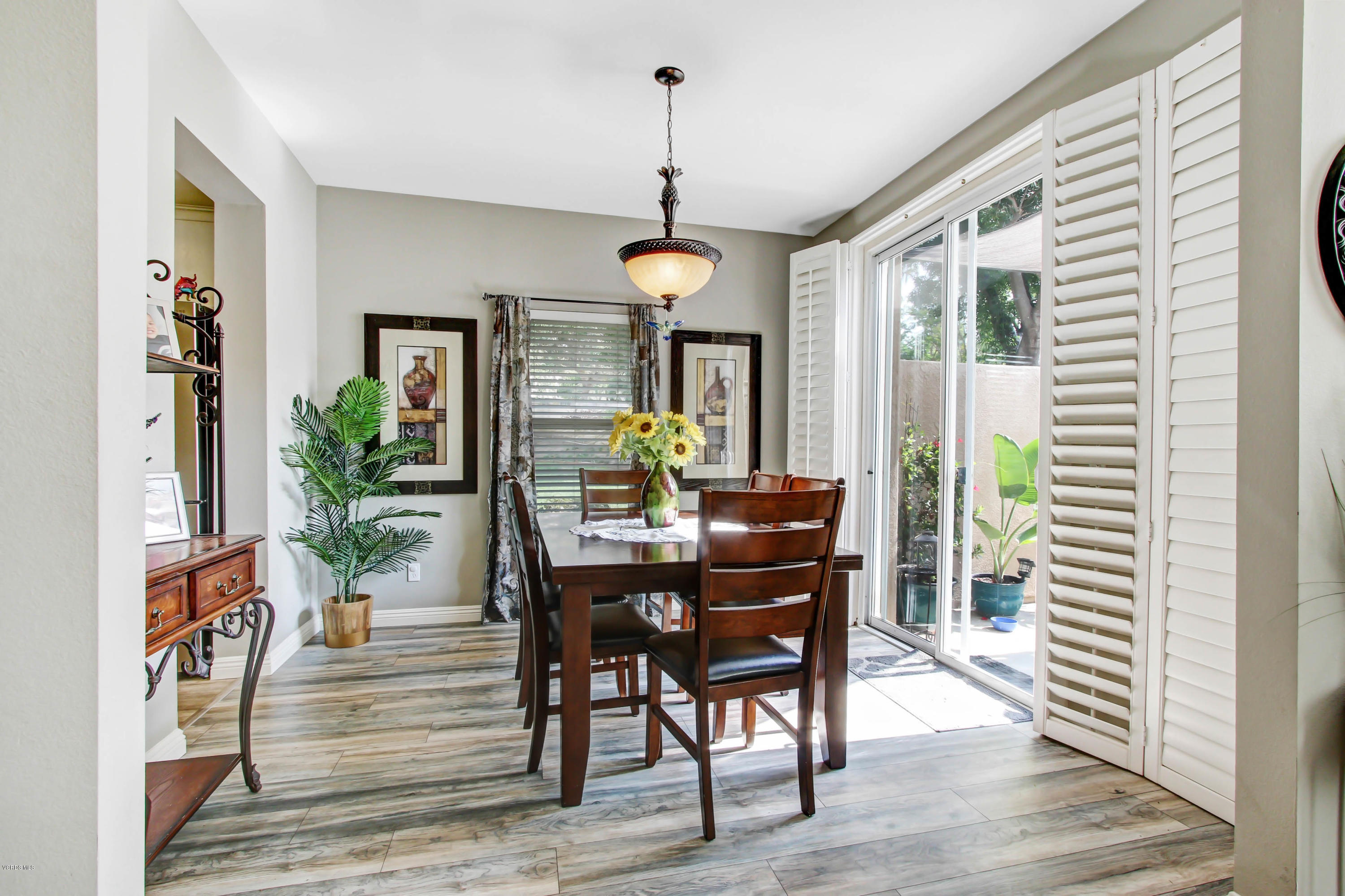 697 Lariate Lane, Unit A Simi Valley, CA 93065 - Photo 12 of 26 a view of a dining room with furniture window and wooden floor