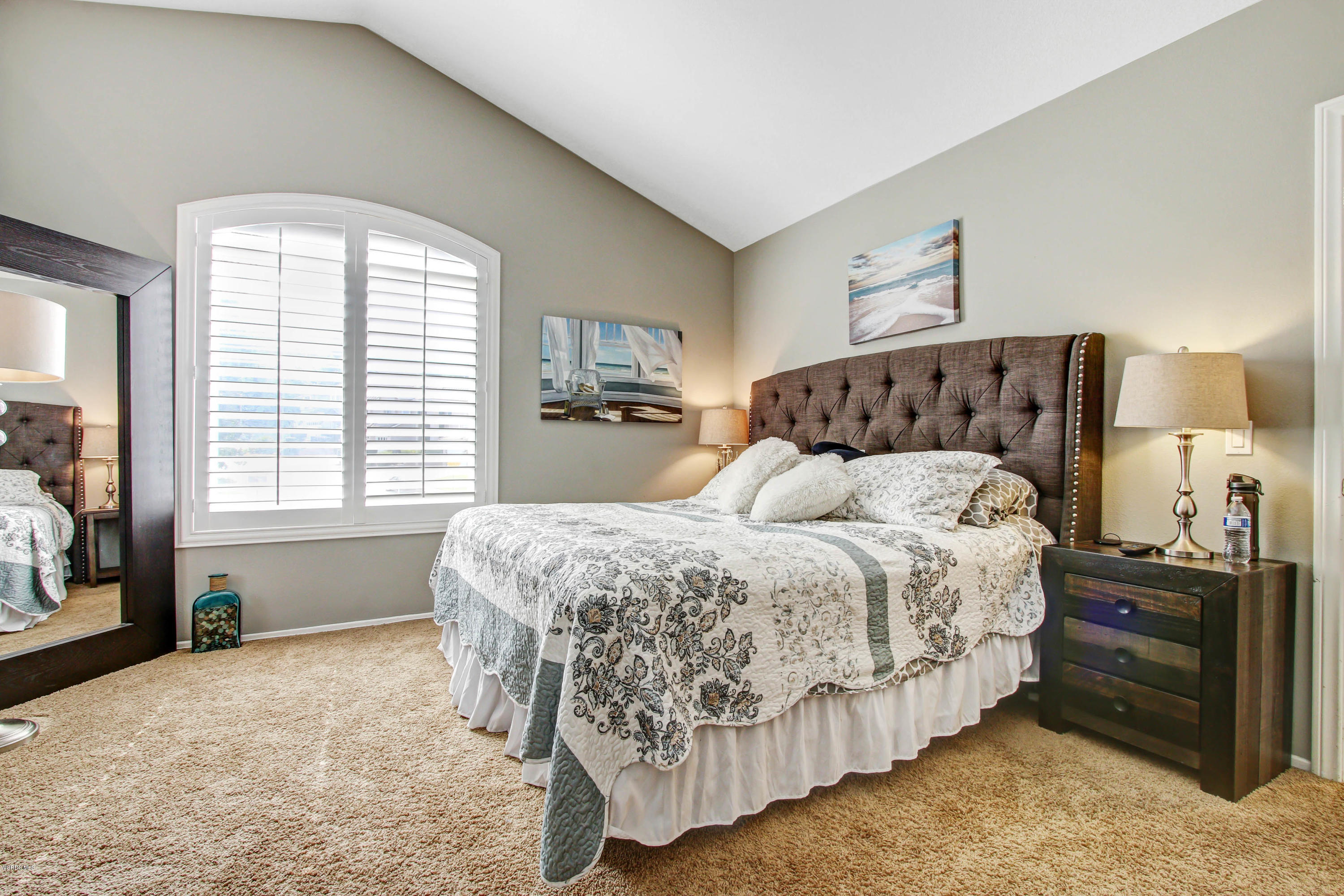 697 Lariate Lane, Unit A Simi Valley, CA 93065 - Photo 13 of 26 a bed sitting in a bedroom next to a window