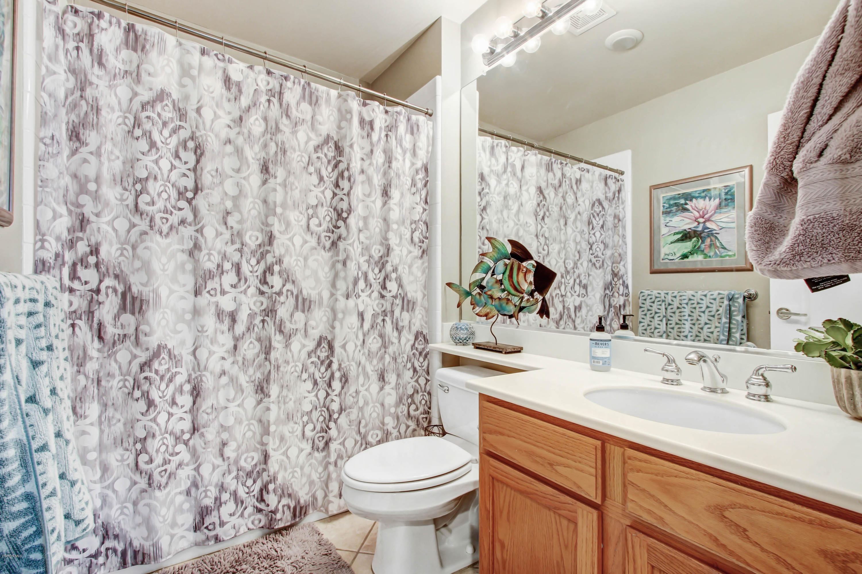 697 Lariate Lane, Unit A Simi Valley, CA 93065 - Photo 17 of 26 a bathroom with a sink toilet and shower