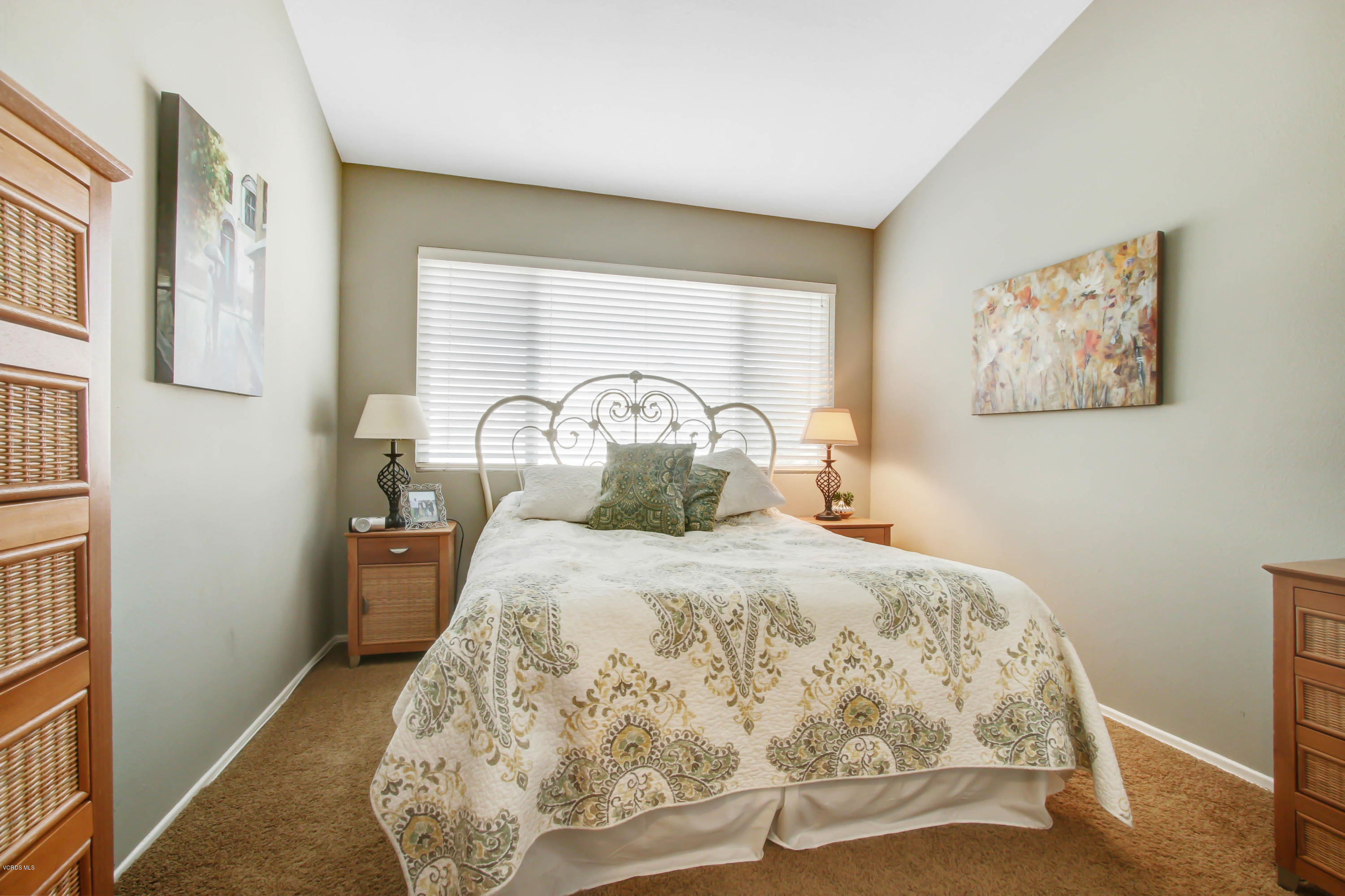 697 Lariate Lane, Unit A Simi Valley, CA 93065 - Photo 18 of 26 a bedroom with a bed and a painting on the wall