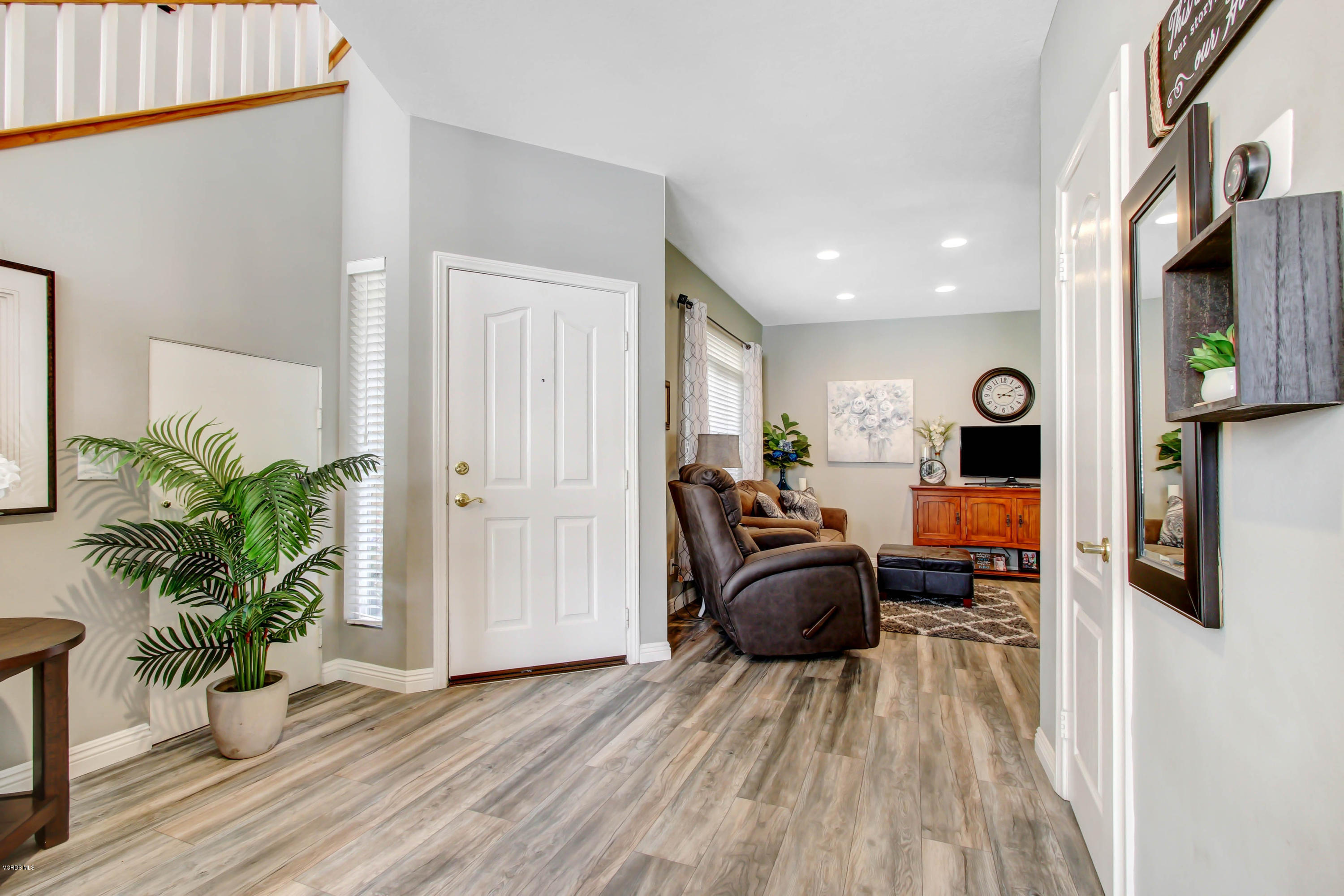 697 Lariate Lane, Unit A Simi Valley, CA 93065 - Photo 3 of 26 a room with furniture and a potted plant
