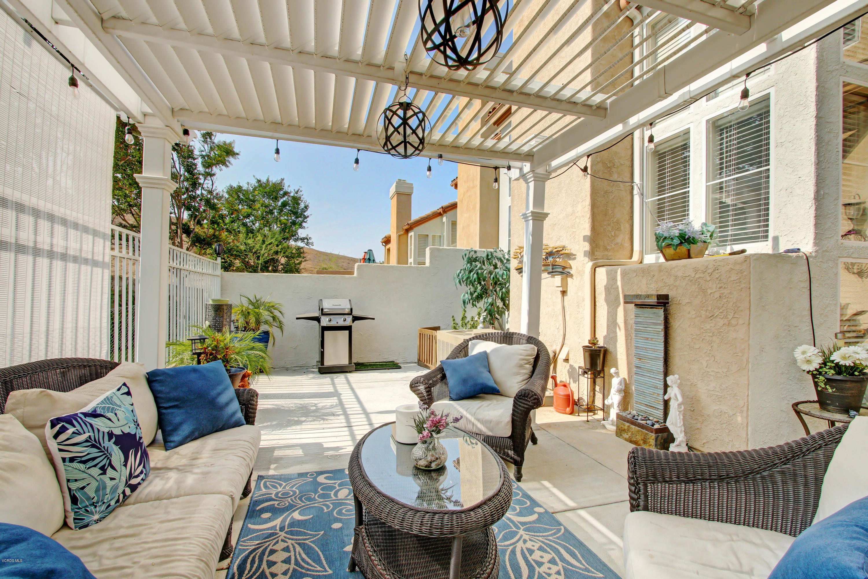 697 Lariate Lane, Unit A Simi Valley, CA 93065 - Photo 21 of 26 a outdoor living space with furniture and a potted plant