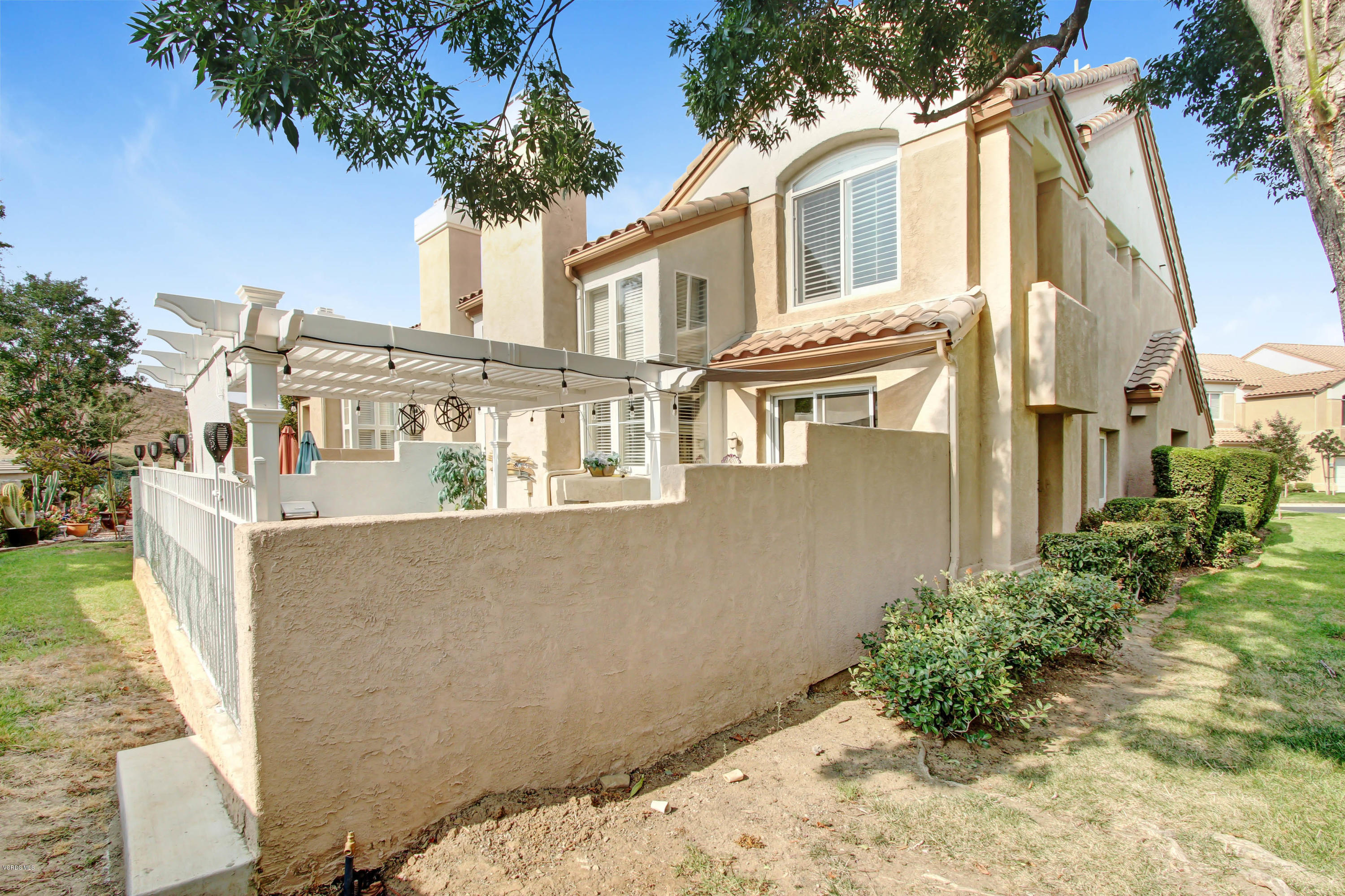 697 Lariate Lane, Unit A Simi Valley, CA 93065 - Photo 23 of 26 front view of a house with a yard