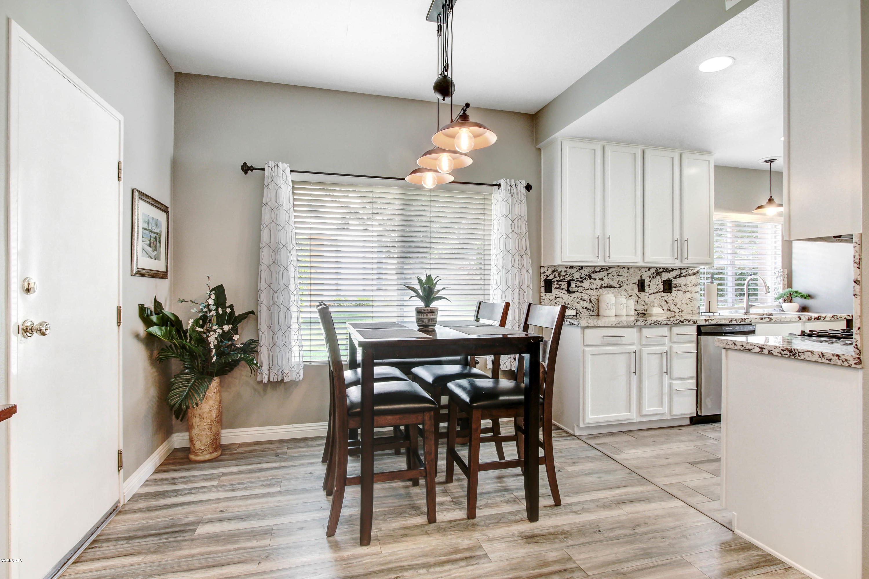 697 Lariate Lane, Unit A Simi Valley, CA 93065 - Photo 6 of 26 a kitchen with a table and chairs in it