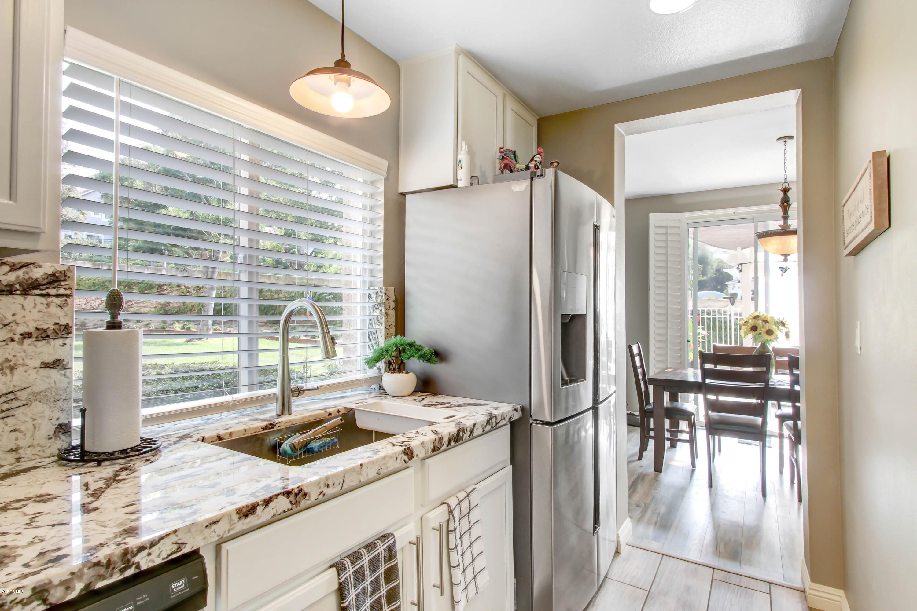 697 Lariate Lane, Unit A Simi Valley, CA 93065 - Photo 9 of 26 a kitchen with a table and chairs