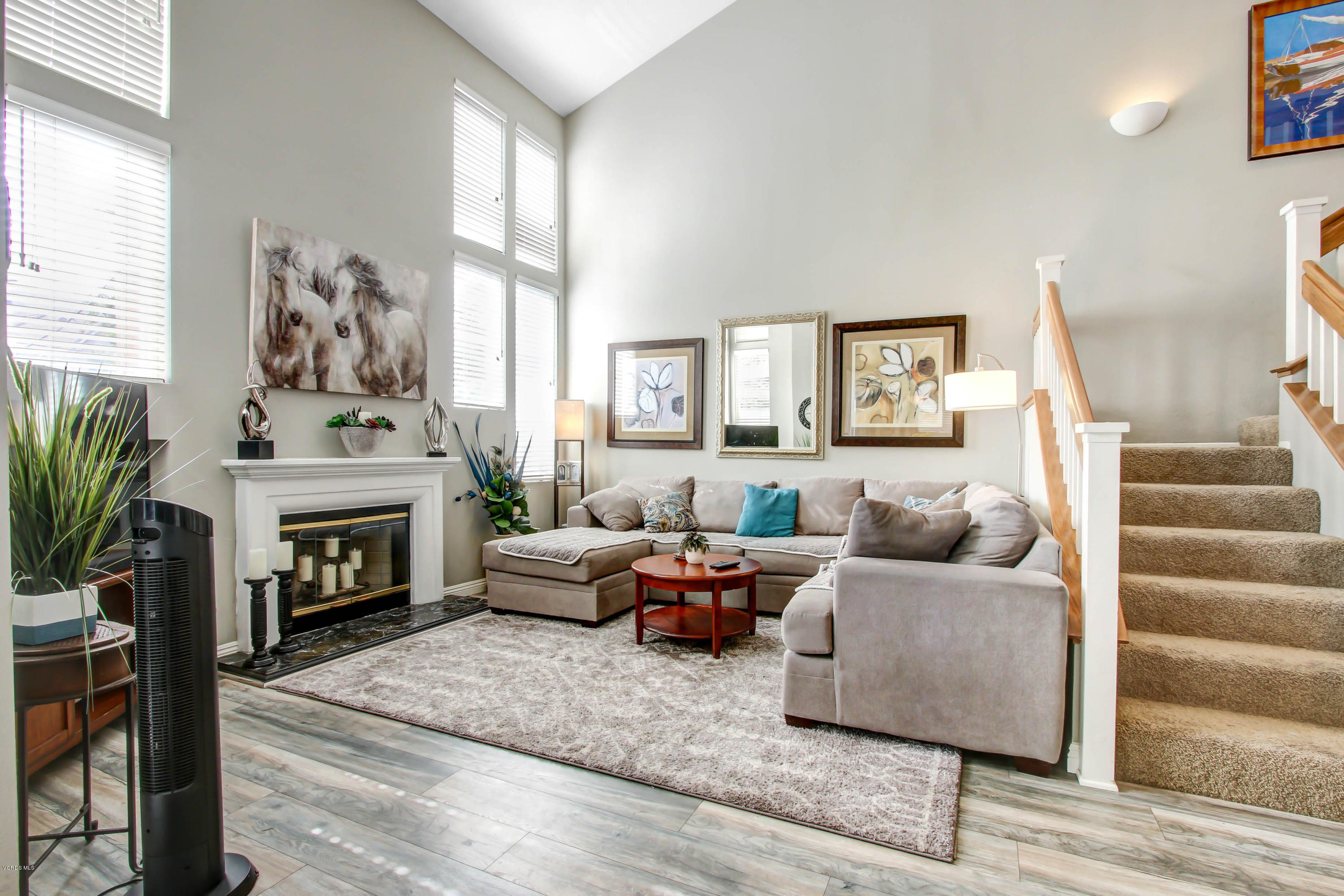 697 Lariate Lane, Unit A Simi Valley, CA 93065 - Photo 10 of 26 a living room with furniture large window and fireplace