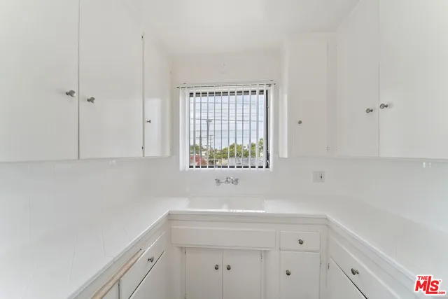 a bathroom with a sink and a window
