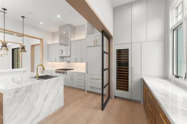 a bathroom with a double vanity sink toilet and shower